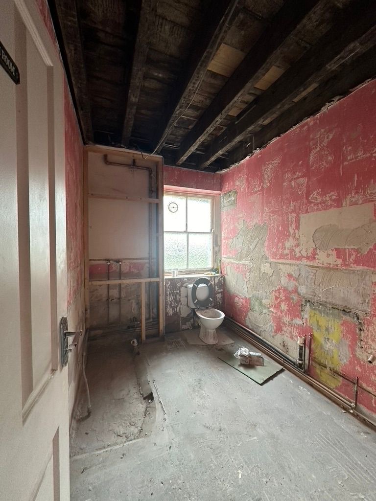 Original bathroom stripped back to substrate before full refit, Kennington