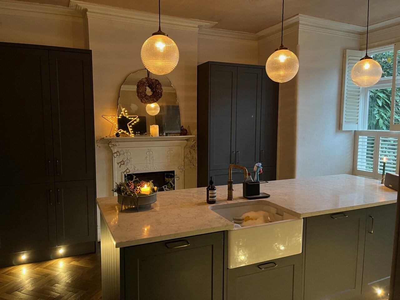 Shaker cabinetry detail with brushed hardware and timber accents