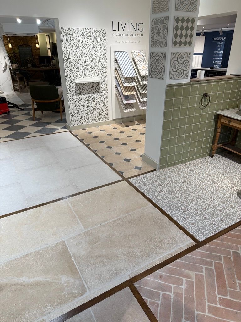 Stone, encaustic and decorative wall tile displays with green tiled panelling and Living decorative wall tile stand, King's Road showroom