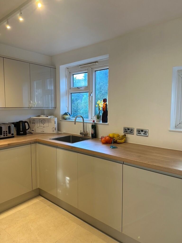 Bright open-plan kitchen aspect toward the garden window, Croydon renovation