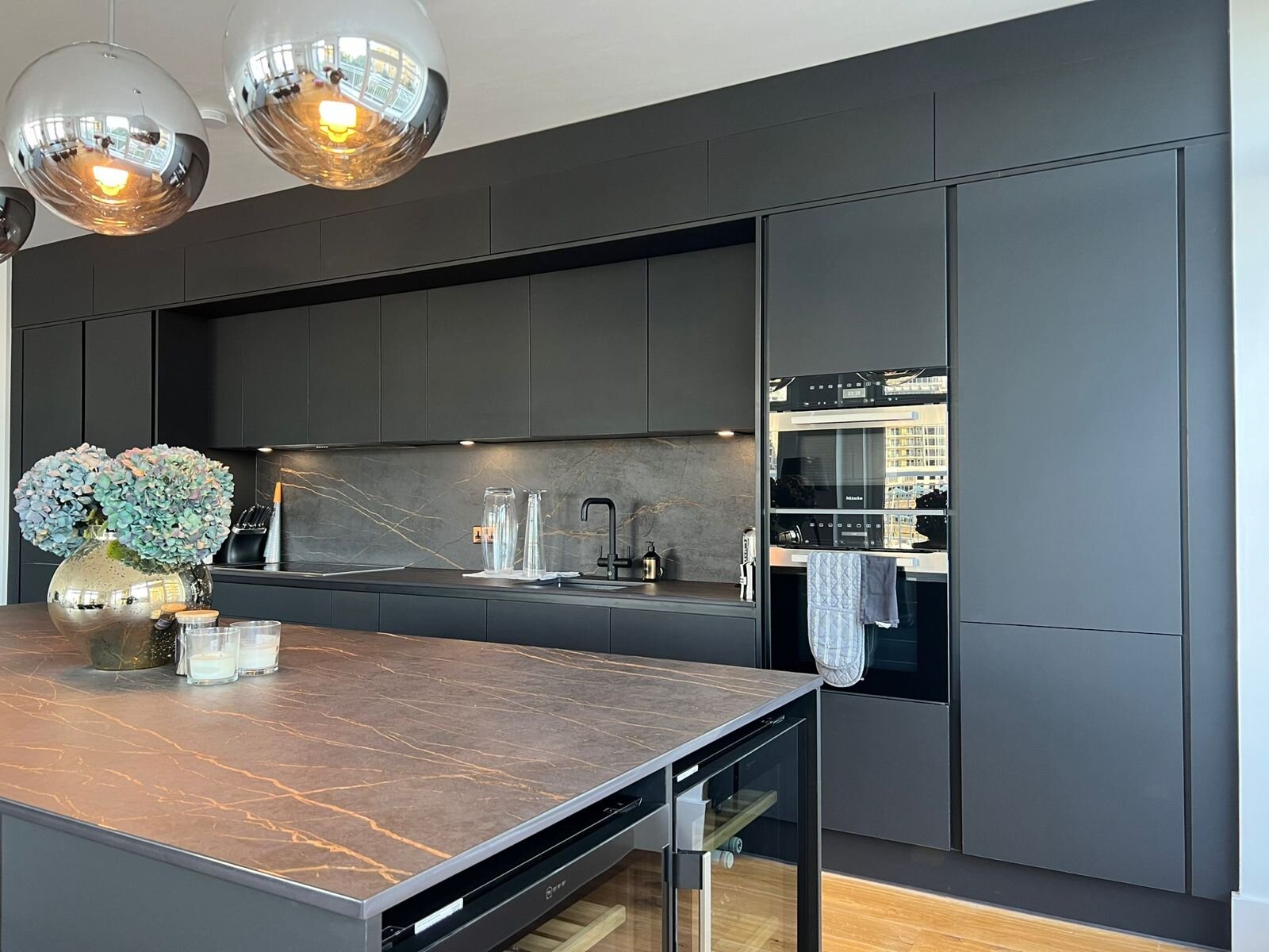 Bespoke island seating with pendant lighting, signature Atmosphere kitchen